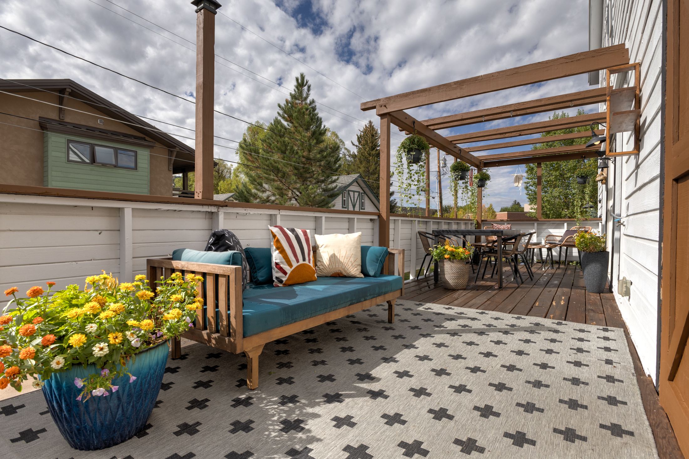 Covered pergola walkway along the deck