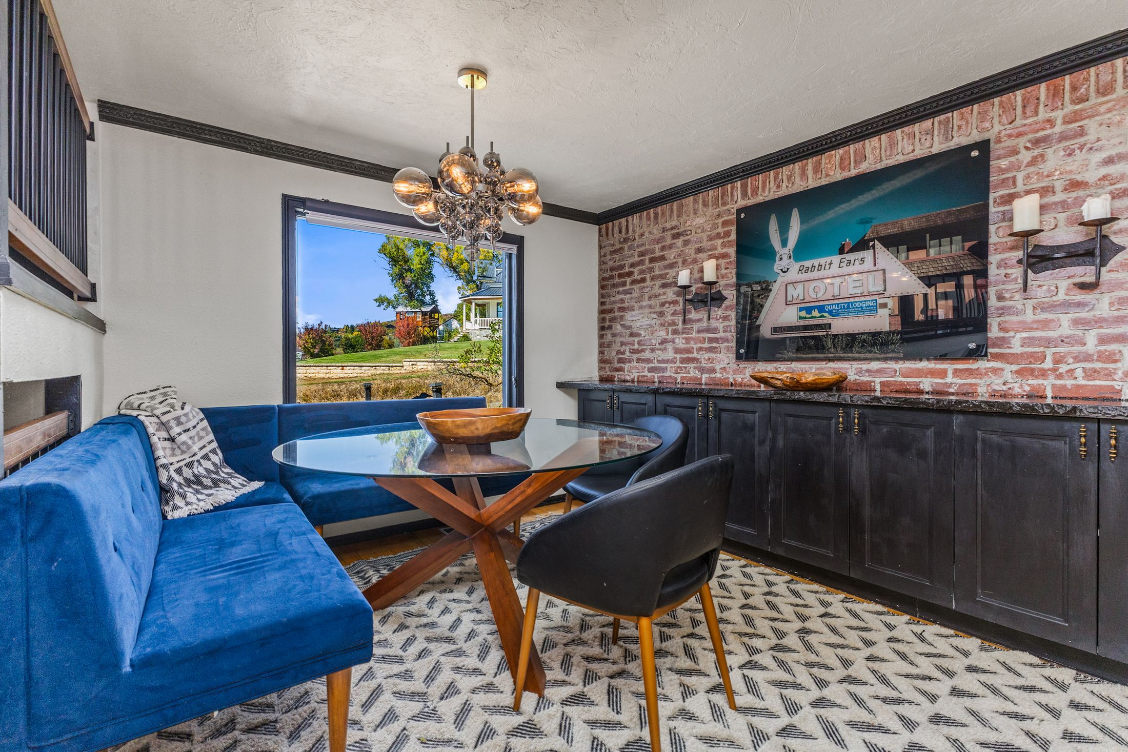 Dining nook with vintage Rabbit Ears Motel sign