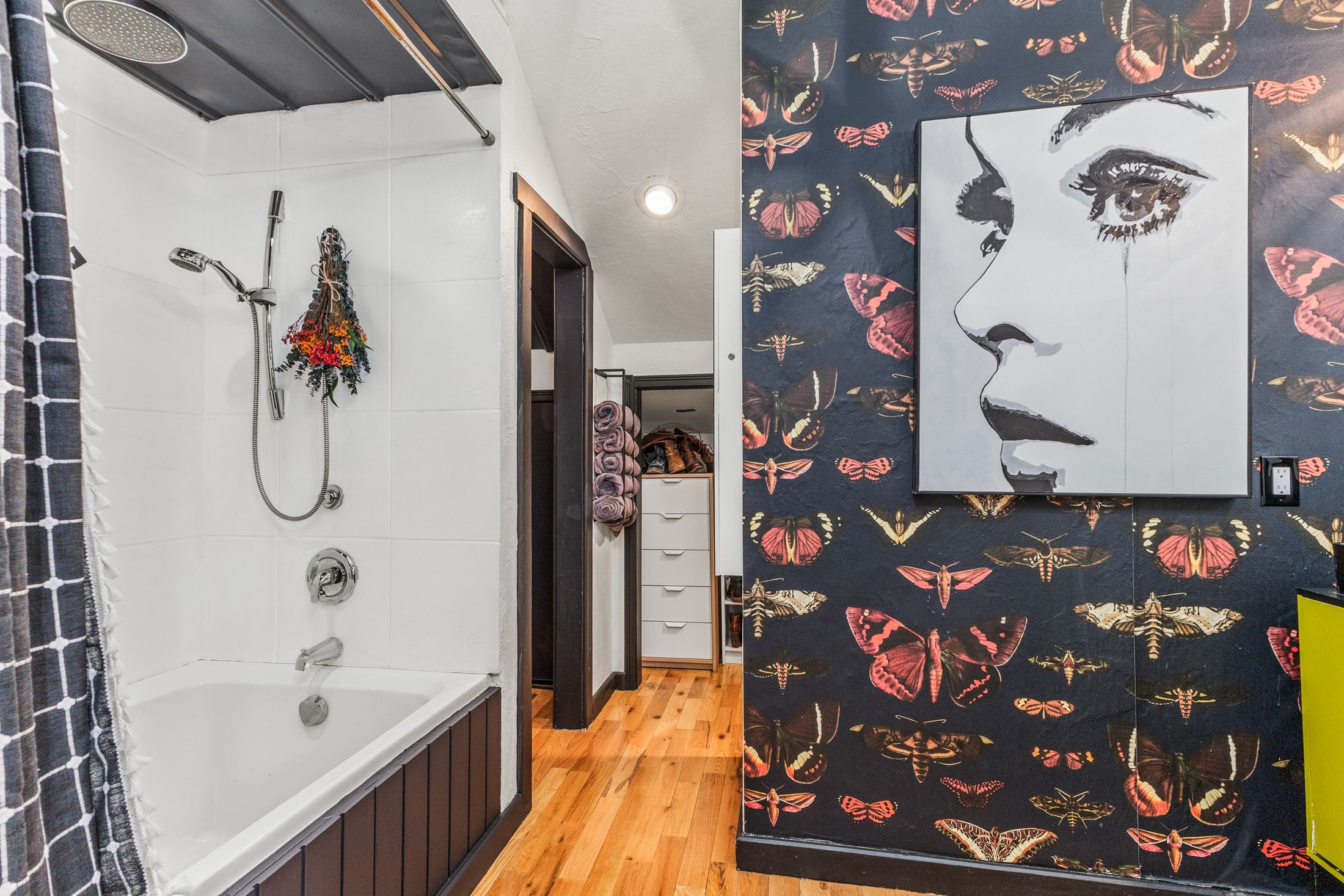 Butterfly-wallpaper bathroom with chartreuse vanity