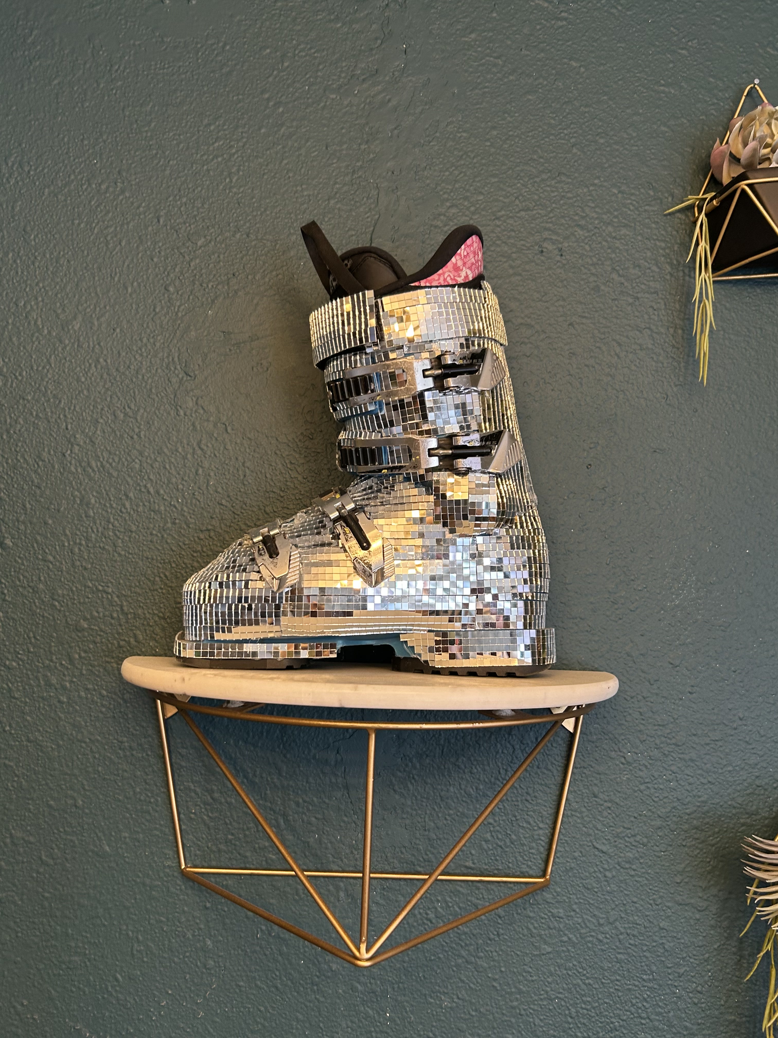 Disco ski boot decor catching the candlelight
